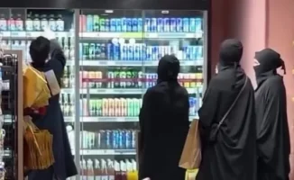 Алматы: Рекламная провокация с 'гаремом' в парандже вызвала полицейское разбирательство